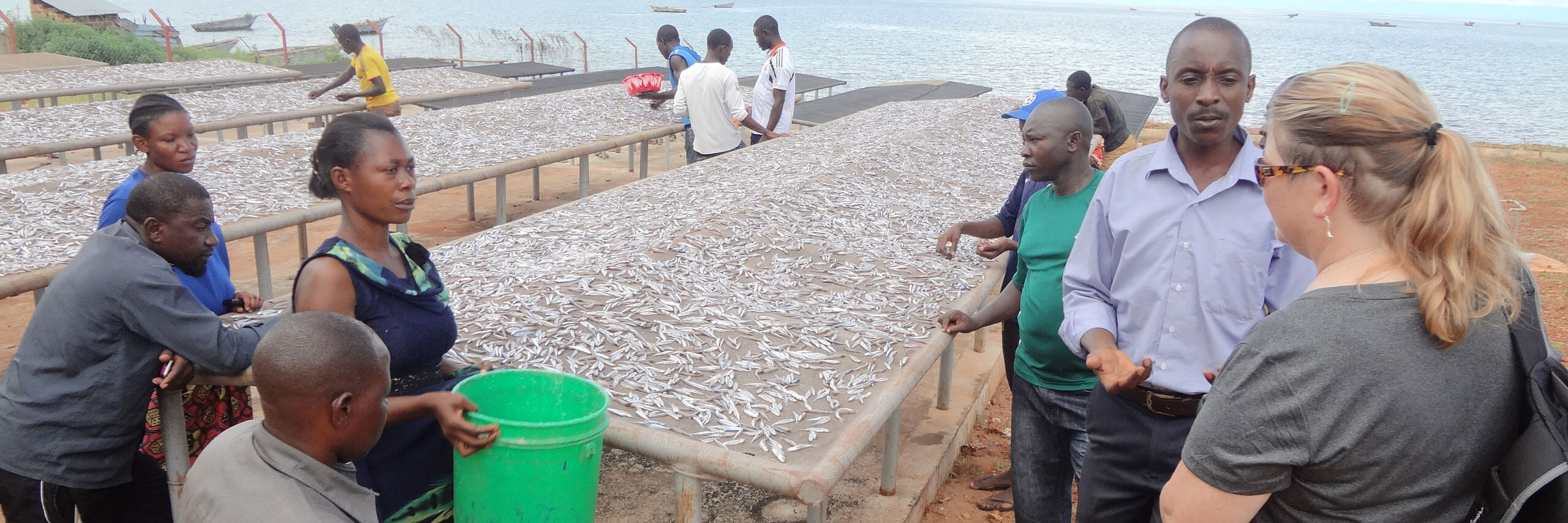 Researcher speaks to fisherman in Tanzania.